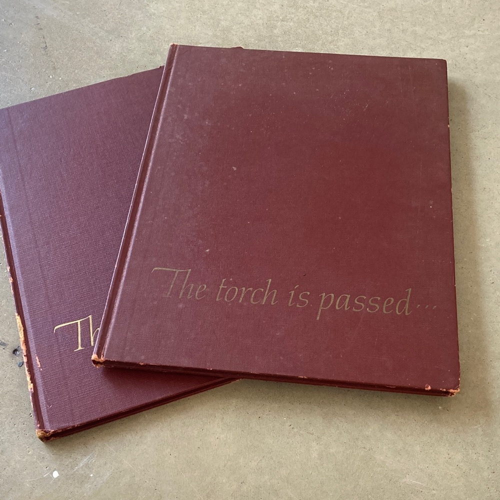 JFK documentary of life and assassination.  Maroon Hardcover Book.